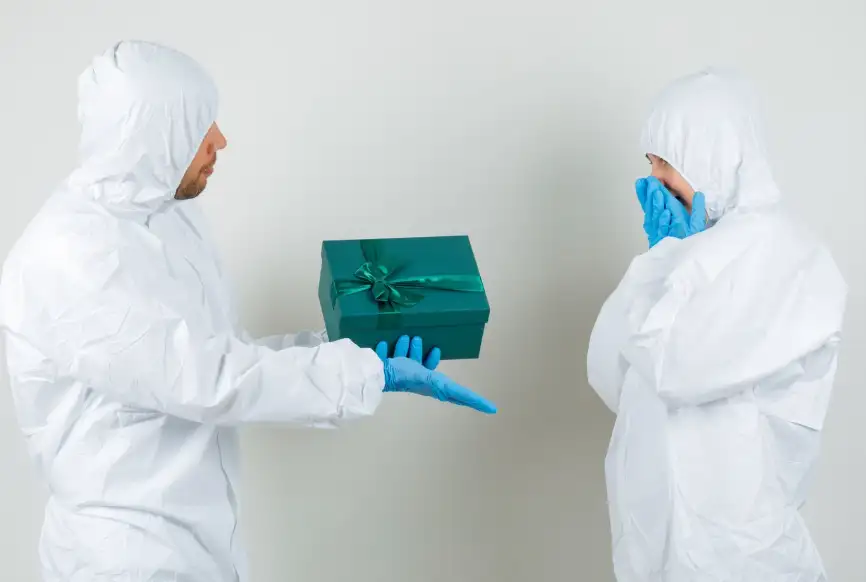 professional mold inspector sharing results of best home mold test kit with homeowner in protective suit